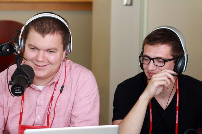 a couple of men wearing headphones
