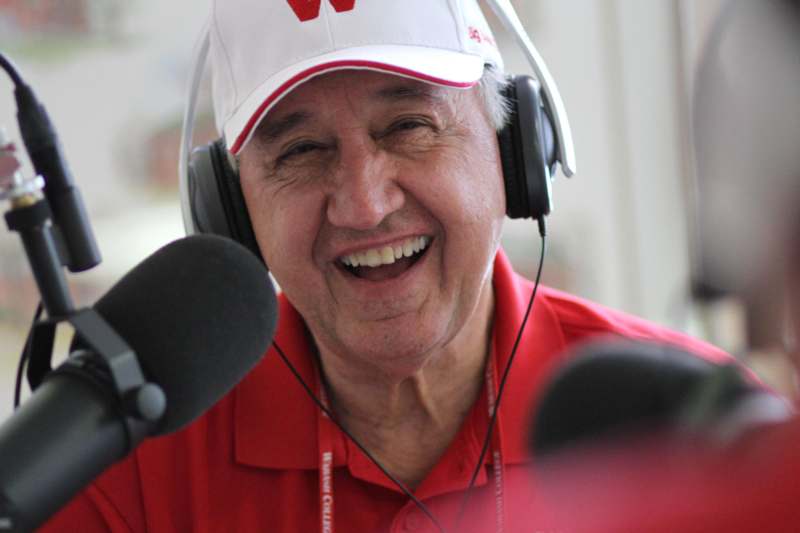 a man wearing headphones and a baseball cap