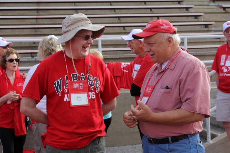 a group of men wearing red shirts and hats