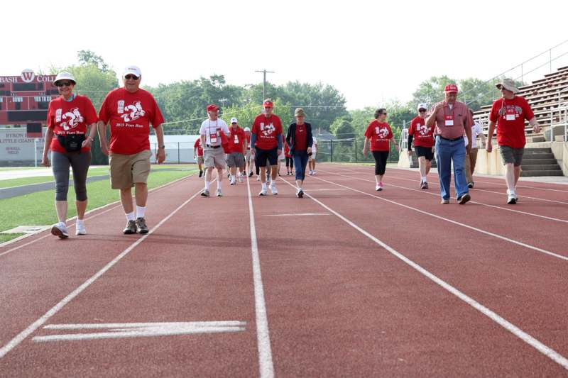 a group of people walking on a track