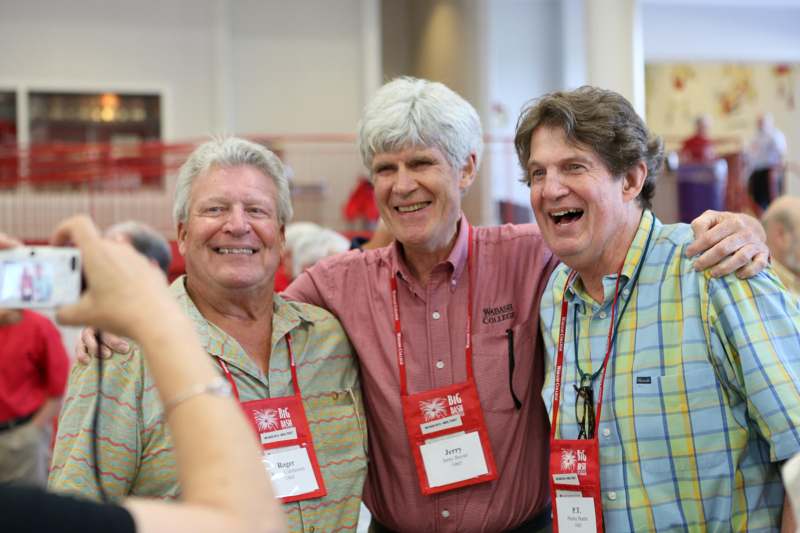 a group of men wearing name tags