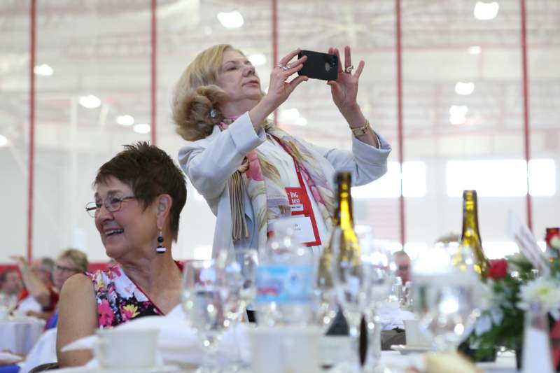 a woman taking a selfie with a phone