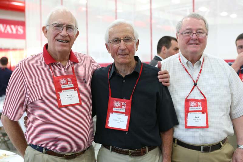 a group of men wearing name tags