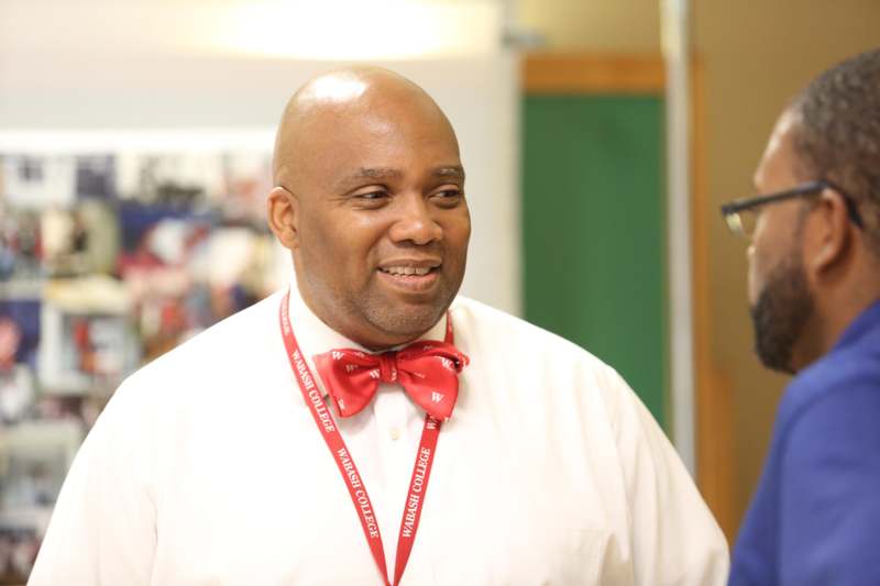 a man wearing a red bow tie