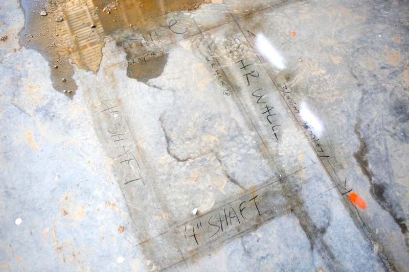 a dirty floor with writing on it