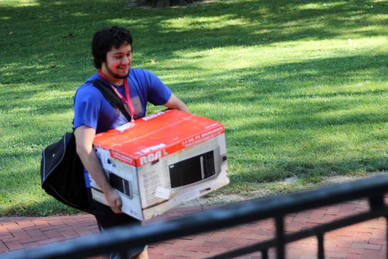 a man carrying a box