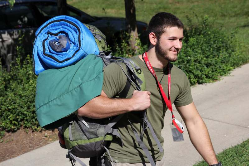 a man carrying a large backpack