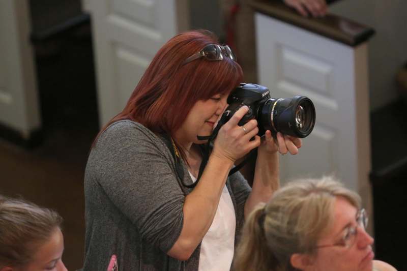 a woman holding a camera