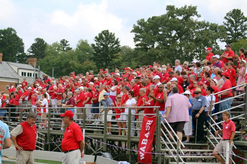 a large crowd of people in red shirts