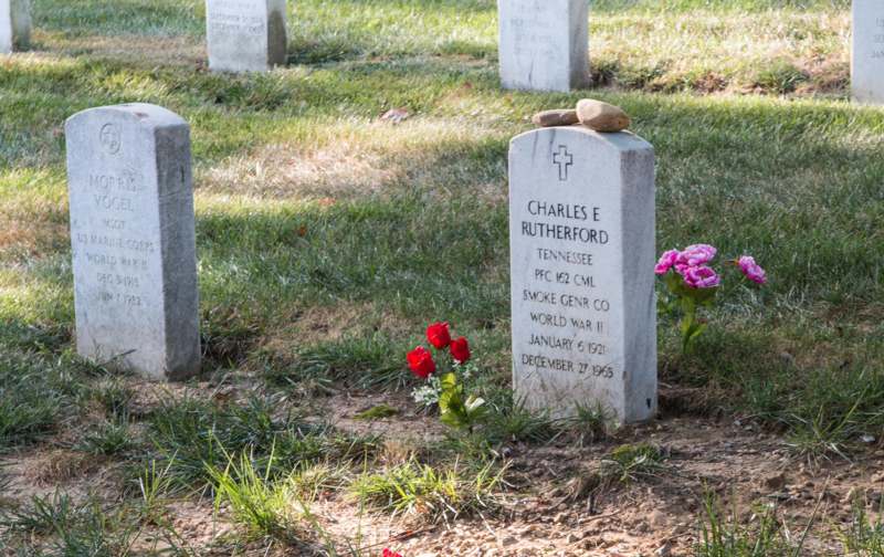 a stone headstone in a cemetery