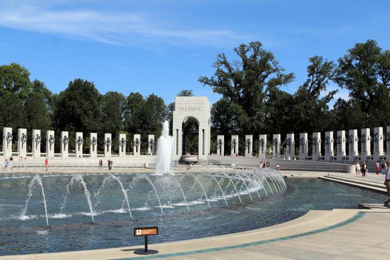 a water fountain in front of a monument with National World War II Memorial in the background