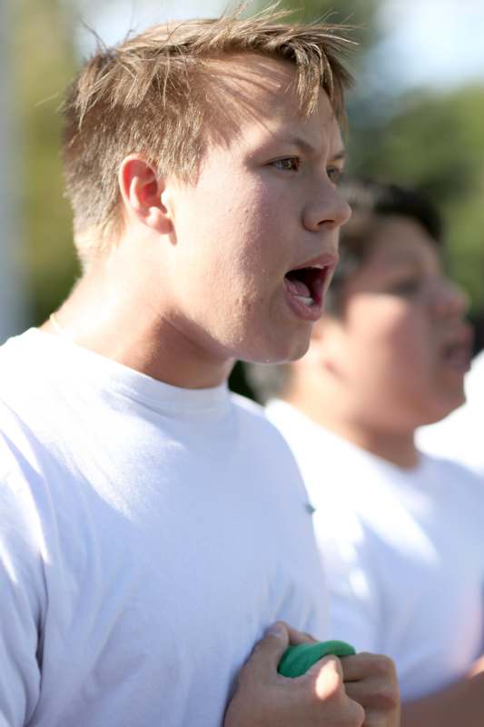 a boy in white t-shirt with his mouth open