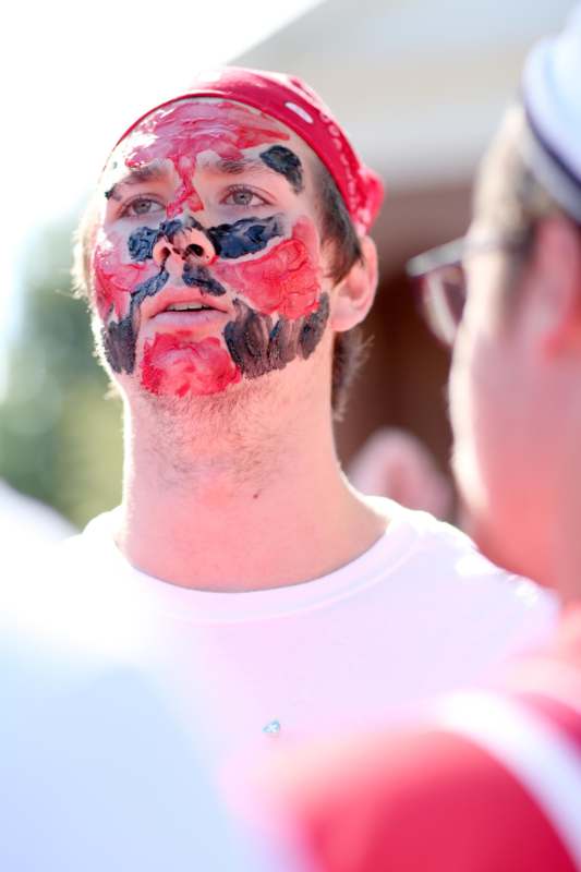 a man with paint on his face