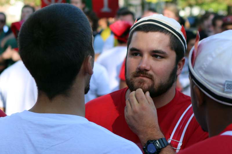 a man touching a beard