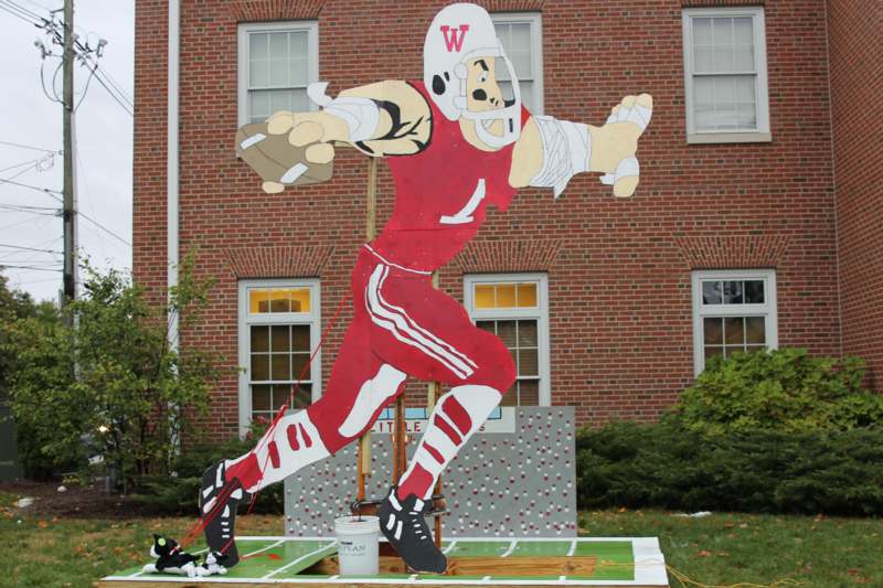 a large cardboard cutout of a football player
