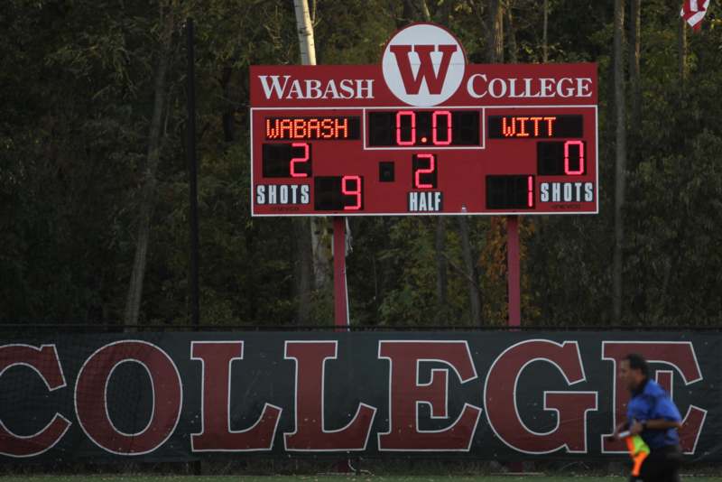 a scoreboard with a red and white letter and numbers