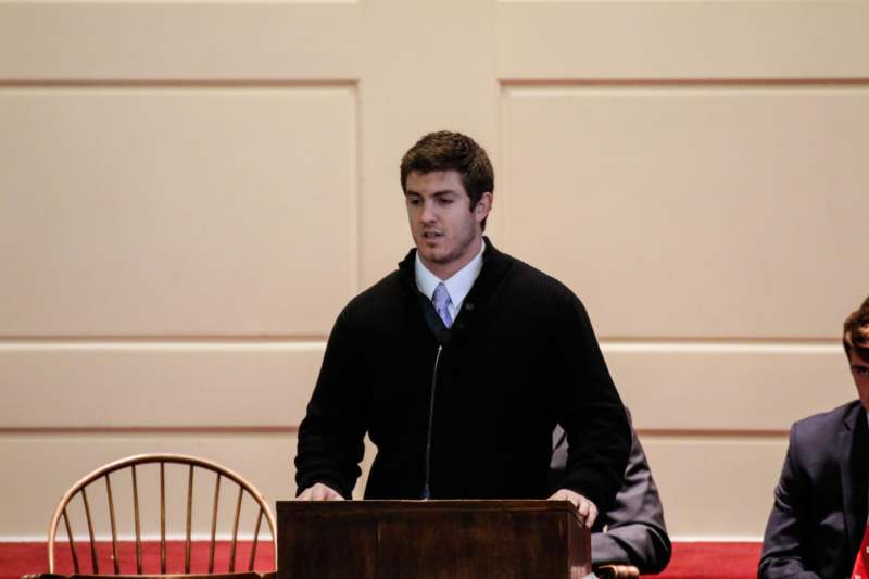 a man standing at a podium