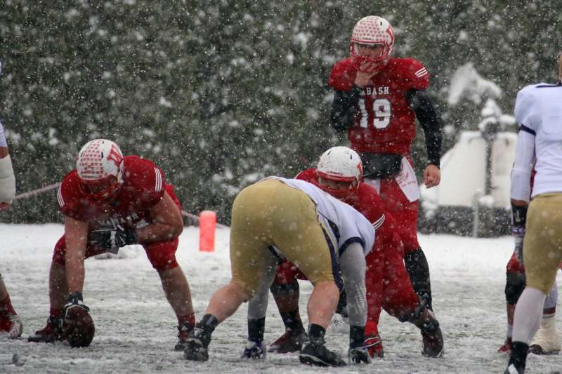 a group of football players in the snow