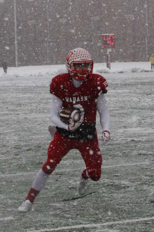 a football player running in the snow