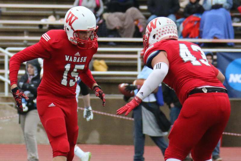 two football players in red uniforms