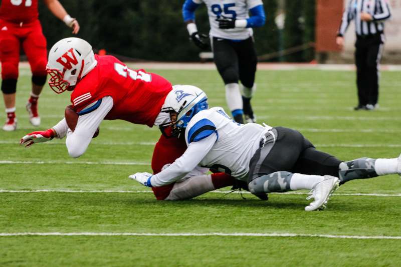 a football player falling down to the ground
