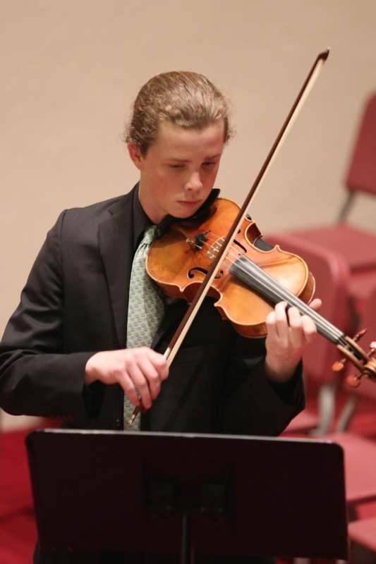 a man playing a violin