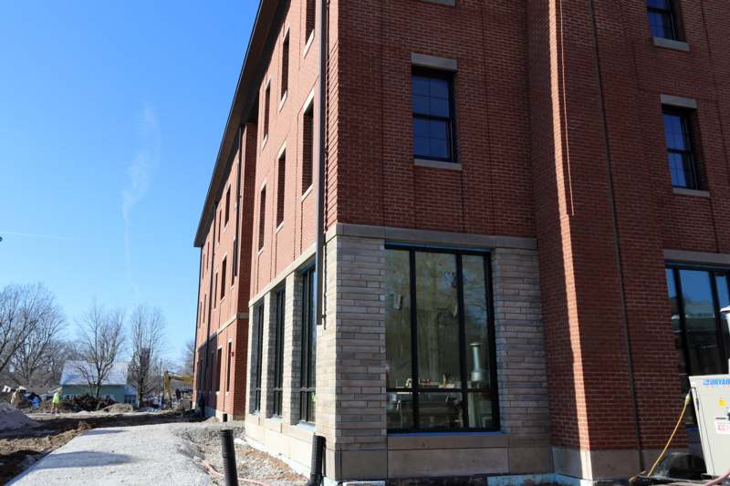a building with windows and a brick wall