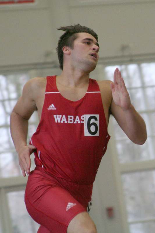 a man running in a red uniform
