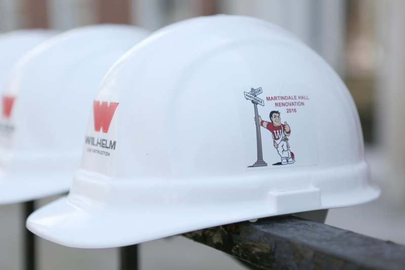 a white hard hats with a cartoon character on them