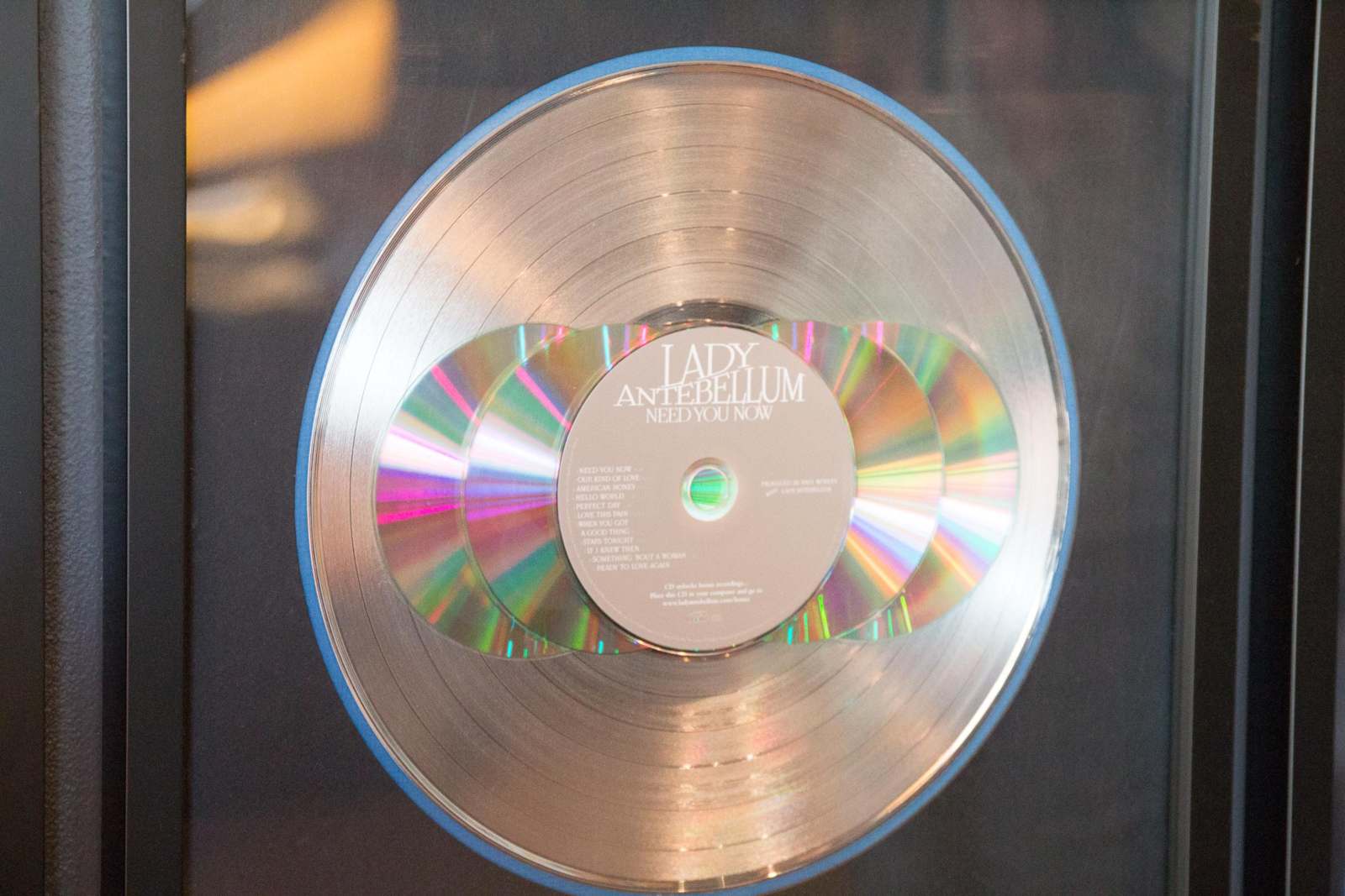 a silver disc with a label on it