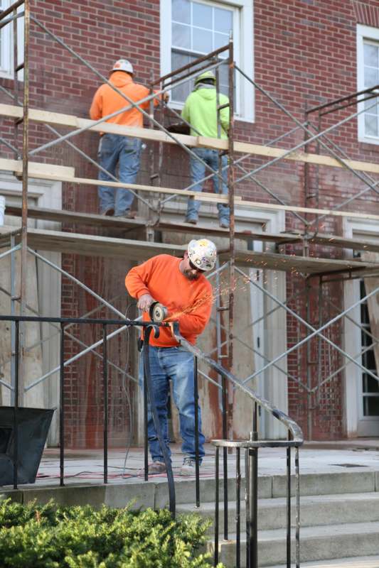 a group of men working on a building