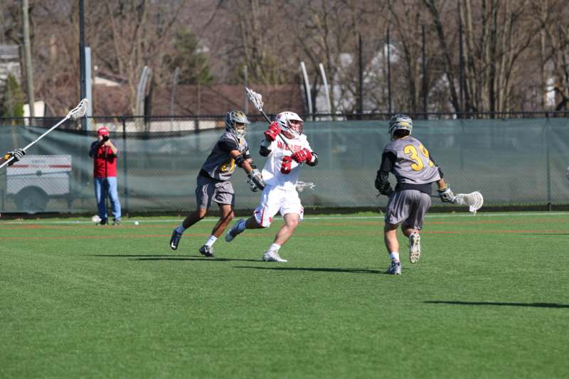 a group of people playing lacrosse