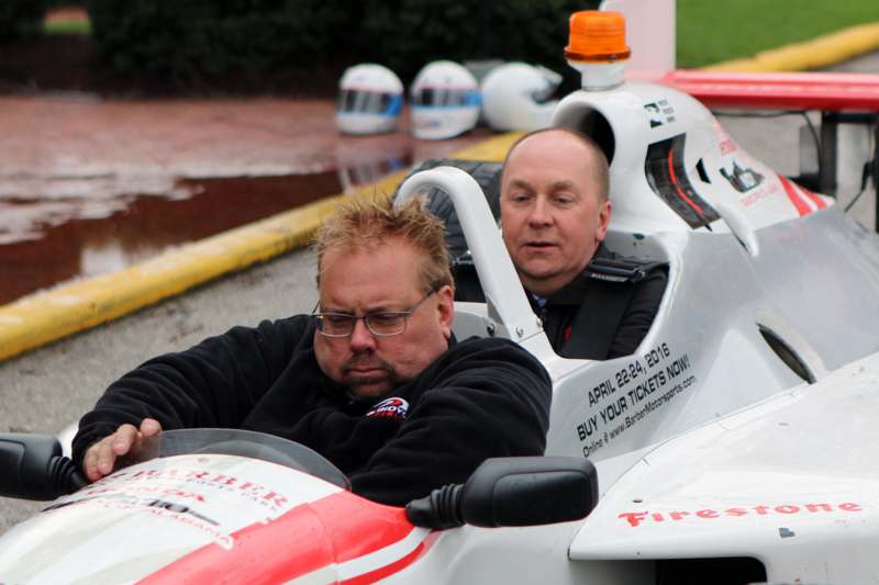 two men in a race car