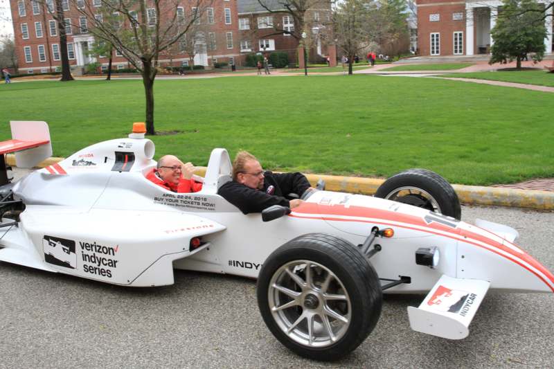 two men in a race car
