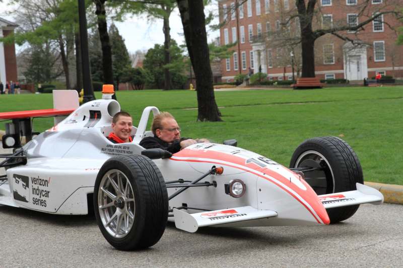 two men driving a race car