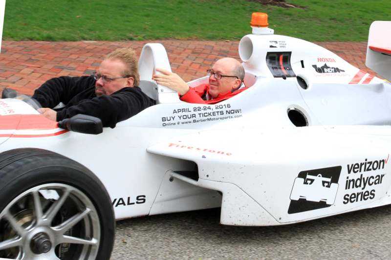 two men driving a race car