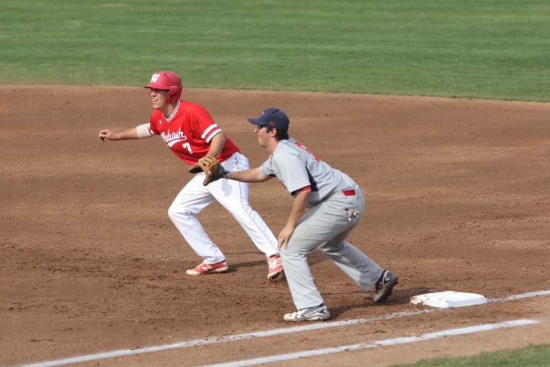 a baseball player running to first base