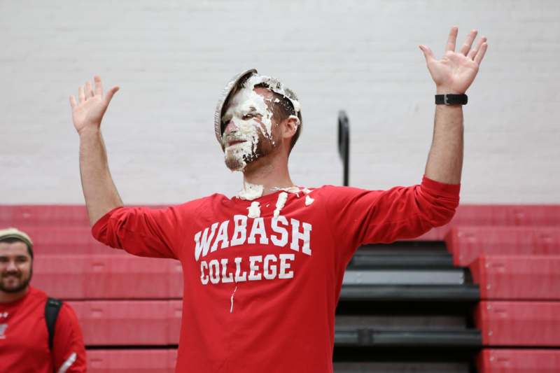 a man with a pie on his face