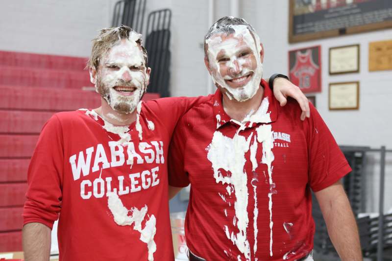 two men covered in cream on their faces