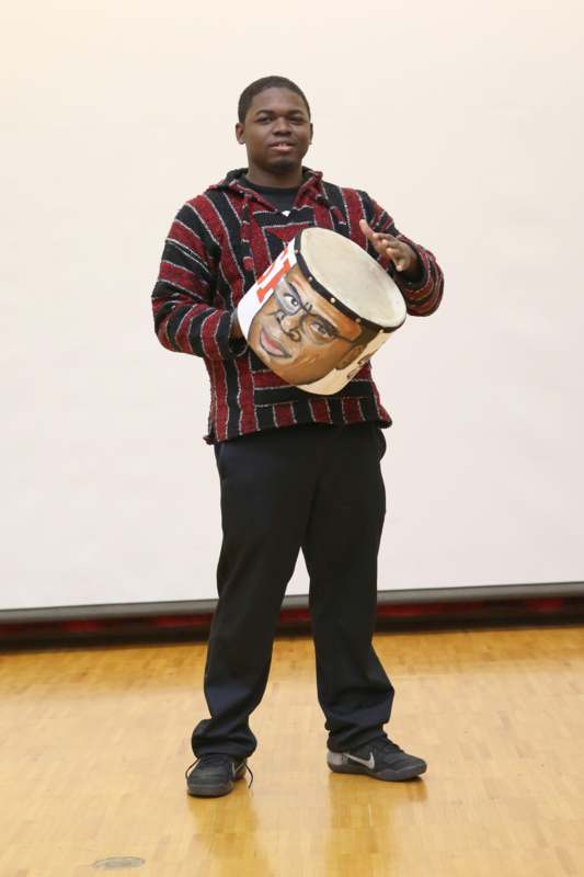 a man holding a drum