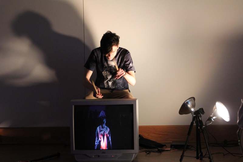 a man sitting on a television