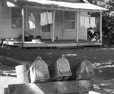 a house with mailboxes on the front porch