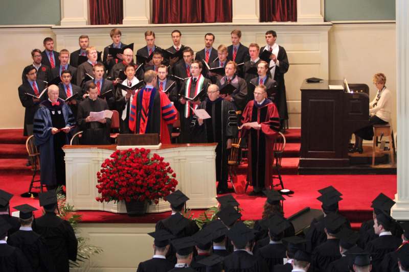 a group of people in graduation gowns and robes
