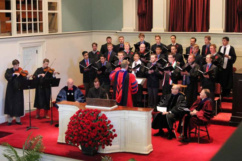 a group of men in robes and a choir