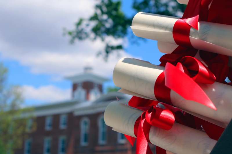 diploma diplomas tied with red ribbons