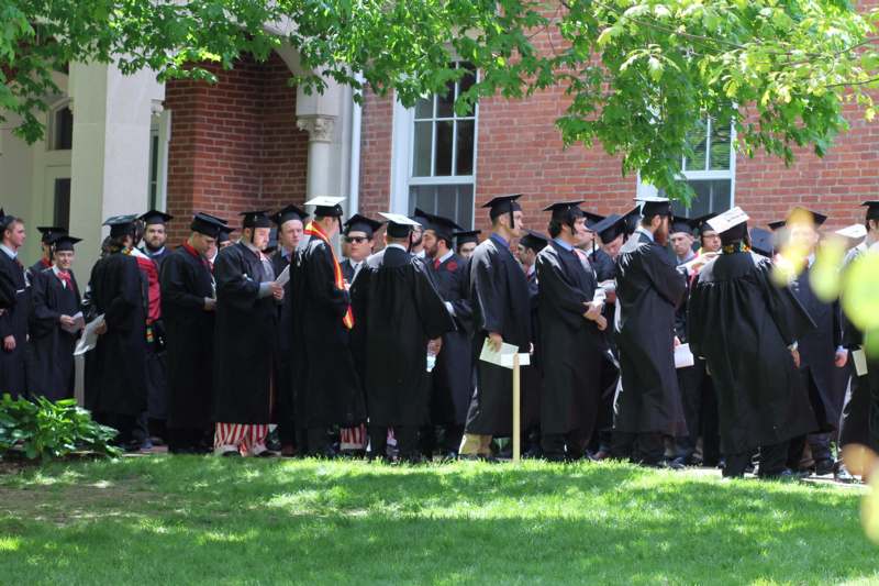 a group of people in black graduation gowns