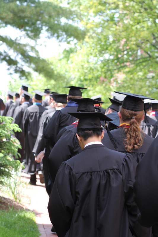 a group of graduates in black gowns and caps