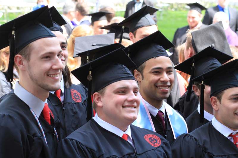 a group of people wearing graduation caps and gowns