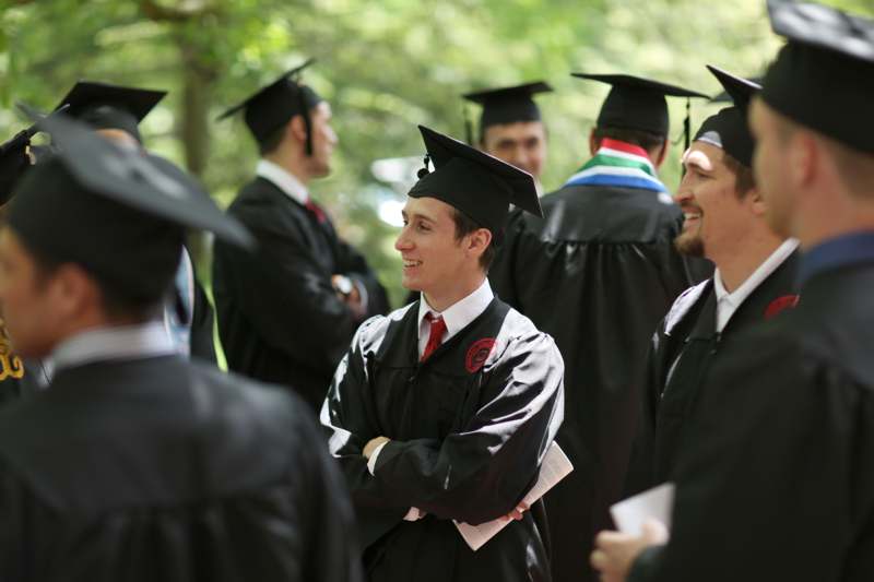 a group of graduates in black gowns and caps