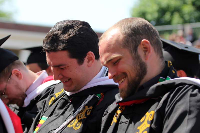 a group of men in graduation attire